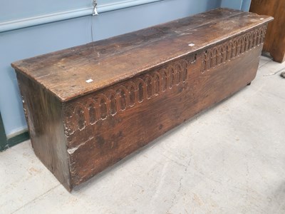 Lot 1426 - An 18th century oak coffer, the top of the...