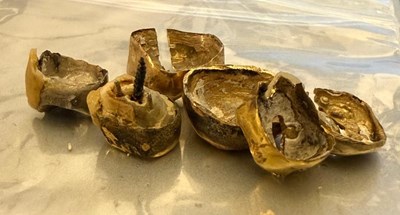 Lot 1169 - Six dental tooth caps, some with parts;...