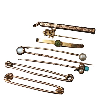 Lot 1172 - Three gold stick pins, one with a 9ct gold...