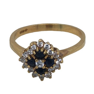 Lot 1180 - A sapphire and diamond cluster ring,...