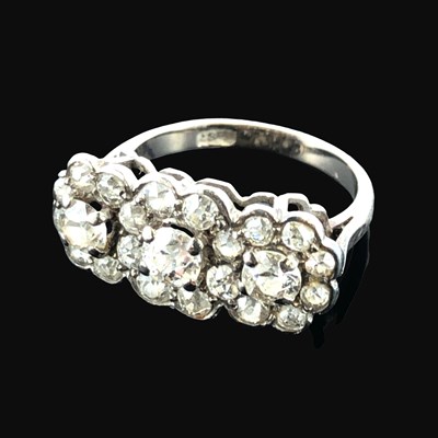Lot 1199 - An 18ct stamped white gold diamond cluster...