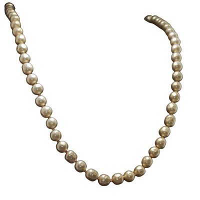 Lot 1202 - A strand of pearls with a silver clasp set...