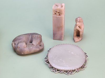 Lot 1230 - An antique oriental green hardstone amulet of...