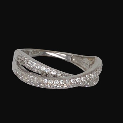 Lot 1244 - A white gold and diamond crossover ring band,...