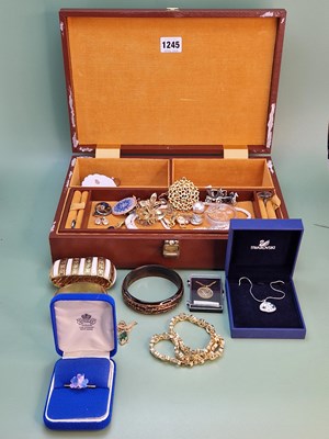 Lot 1245 - D'Orlan, 9ct metal core bangle, Swarovski 9ct...