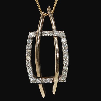 Lot 1250 - A 9ct hallmarked gold CZ pendant, suspended on...