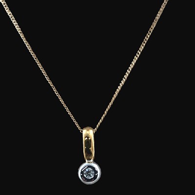Lot 1254 - An 18ct hallmarked gold and diamond pendant...