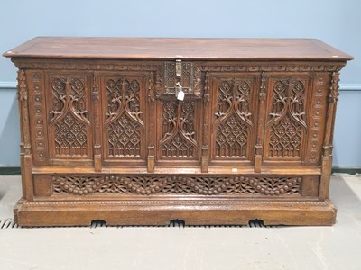 Lot 1391 - A substantial continental oak coffer in the...