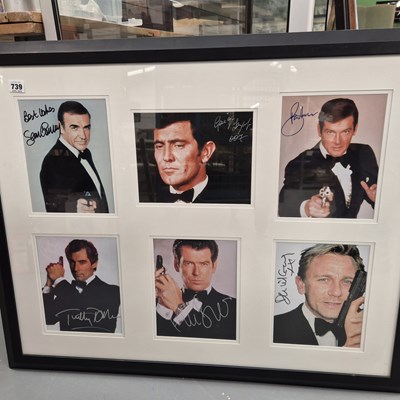 Lot 739 - James Bond; a framed group of six autograph...