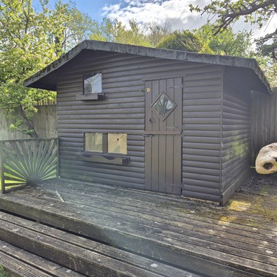 Lot 487 - A large, solid wood garden playhouse den....
