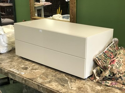 Lot 414A - An off-white two drawer television stand H 40...