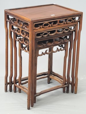 Lot 1236 - A nest of four Chinese hardwood tables with...