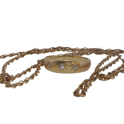 Lot 1006 - An 18ct gold three-stone diamond gypsy set...