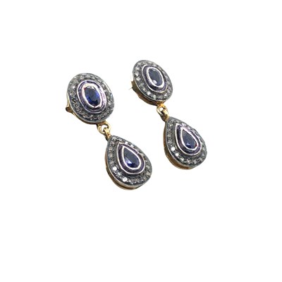 Lot 1061 - A pair of double drop earrings set with pear...