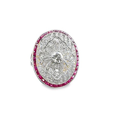 Lot 1062 - A large and ornate oval platinum dress ring...