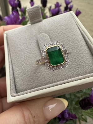 Lot 1067 - An 18ct white and yellow gold ring set with a...