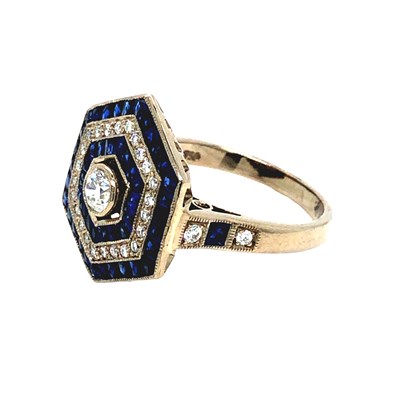 Lot 1080 - A hallmarked 18ct white gold hexagonal ring...