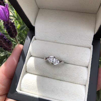 Lot 1087 - An 18ct white gold solitaire diamond twist...