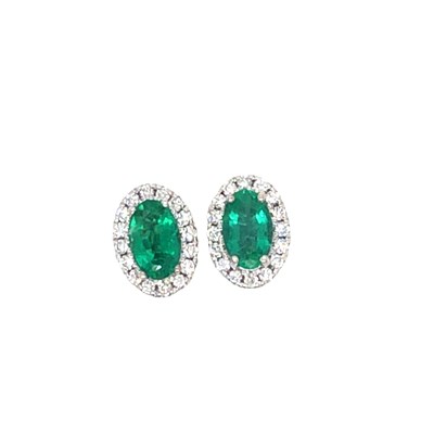 Lot 1098 - A pair of 18ct white gold oval emerald and...