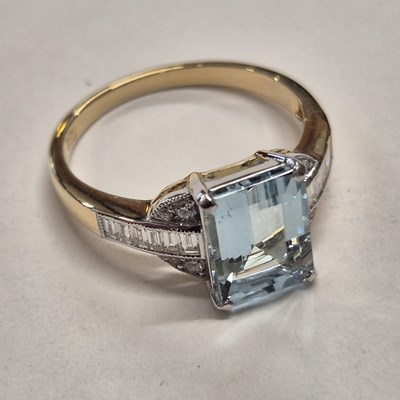 Lot 1064 - A hallmarked 18ct yellow and white gold ring...