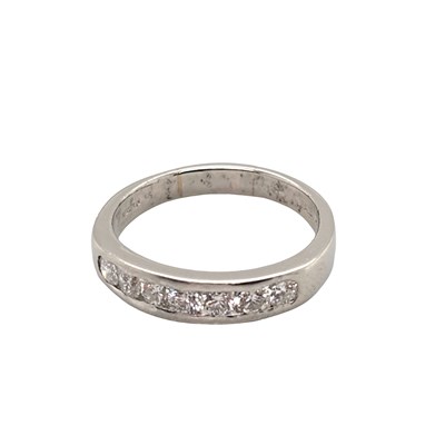 Lot 1016 - Hallmarked platinum half eternity ring,...