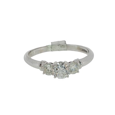 Lot 1030 - Three-stone diamond trilogy ring, claw-set...