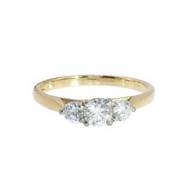 Lot 1033 - Three-stone diamond trilogy ring; hallmarked...