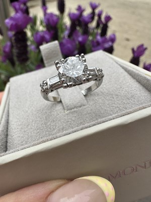Lot 1041 - A diamond solitaire ring, centred with a round...