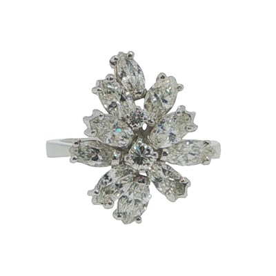 Lot 1043 - A marquise cut diamond cluster ring, claw set...