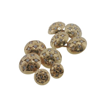 Lot 1057 - A matched dress set comprising nine 18ct gold...