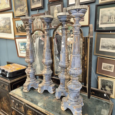 Lot 1 - A set of four Italianate pricket candlesticks...