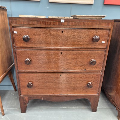 Lot 12 - A late Georgian mahogany chest of three...
