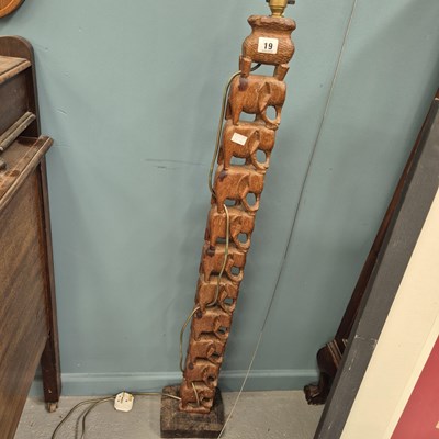 Lot 19 - An unusual carved wood stacked elephant lamp H...