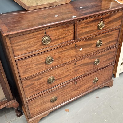Lot 23 - A late Georgian mahogany chest of two short...