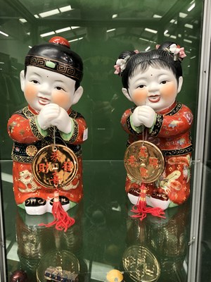 Lot 502 - A pair of Chinese ceramic figures modelled as...