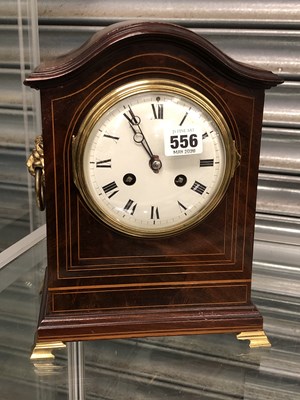 Lot 556 - A 20th century mahogany mantel clock, the...