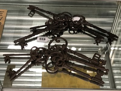 Lot 559 - A collection of large decorative cast metal keys