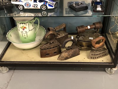 Lot 570 - A collection of antique and vintage flat irons,...