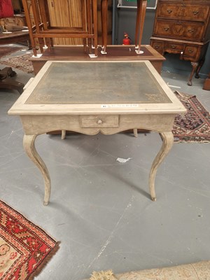 Lot 81 - A square leather topped painted table with a...