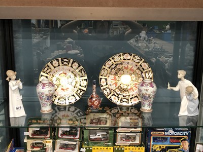 Lot 576 - A pair of Royal Crown Derby Imari pattern...