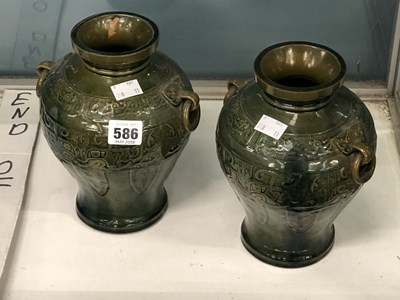 Lot 586 - A pair of Tang-style Chinese vases with ring...