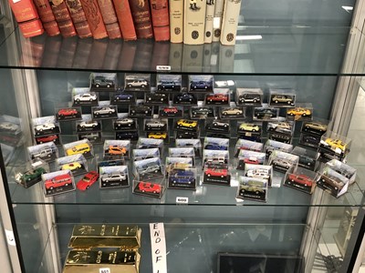 Lot 600 - A collection of toy cars in cases by Cararana,...