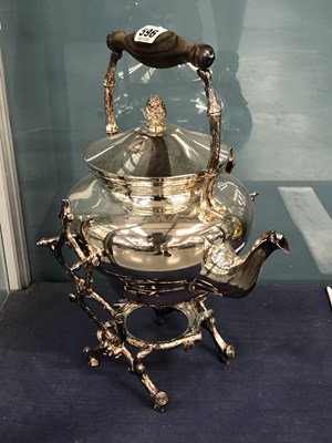 Lot 596 - A silver plated teapot and stand