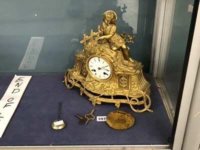 Lot 597 - An antique gilt metal figural mantel clock...