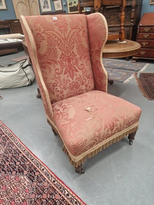 Lot 95 - A Victorian wing back nursing chair on turned...