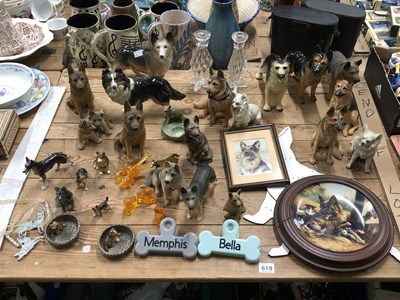 Lot 619 - A collection of dog figurines, mostly German...