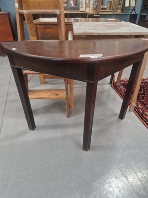 Lot 103 - An early 20th century mahogany demi-lune table,...