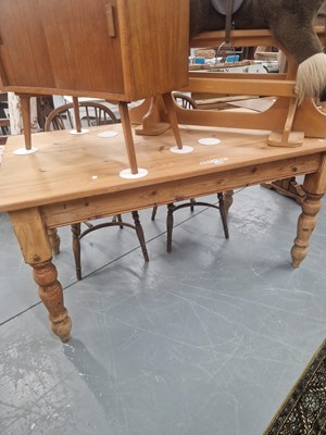 Lot 112 - A 20th century pine kitchen table with drawers...