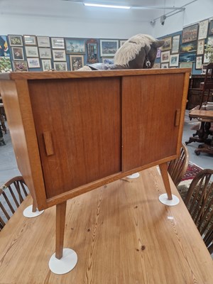 Lot 113 - A mid century modern oak side cabinet, the...