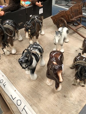Lot 657 - Seven ceramic shire horses and a wooden cart